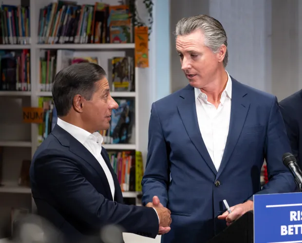 CA Governor Gavin Newsom shakes hands with LAUSD Superintendent Alberto...