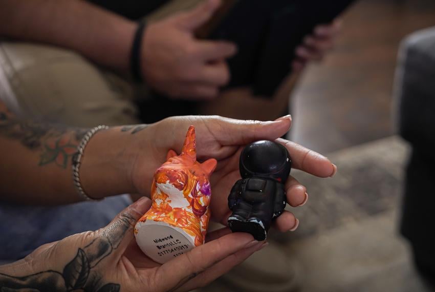 Alfredo and Daniela Santos show us the arts and made by their daughter, age 4, at their home in Midland, Texas on October 6, 2025. The Santos daughter especially enjoys painting ceramic figures.