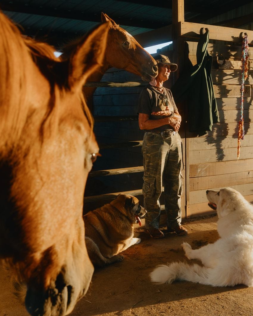 Cheryl Shadden offers treats to her horses on her land in Hood County on September 24, 2025. Shadden’s land, which she’s owned for 30 years, neighbors the MARA cryptocurrency facility built in 2022.