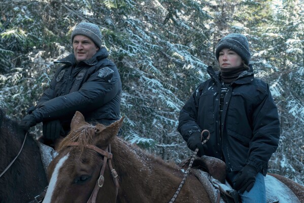 This image released by Apple TV+ shows Haley Bennett, right, and Jason Clarke in a scene from "The Last Frontier." (Apple TV+ via AP)