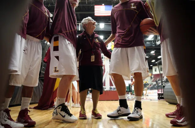 Sister Jean Dolores Schmidt says her pre-game prayer in the huddle before a Loyola Ramblers basketball game, March 2, 2013, at the Gentile Center. (Brian Cassella/Chicago Tribune)