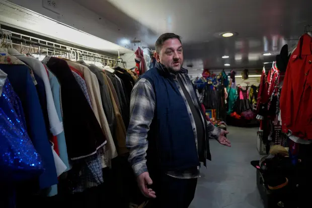 Owner Courtland Hickey talks about how tariffs have increased the cost of new costumes and his hope for selling some of his vintage inventory at Chicago Costume, Wednesday, Sept. 17, 2025, in Chicago. (AP Photo/Erin Hooley)