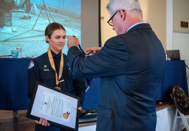 Devon Beebe, a Long Beach Marine Safety Officer, receives a...