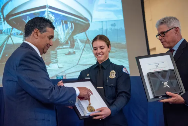 Devon Beebe, a Long Beach Marine Safety Officer, receives a...