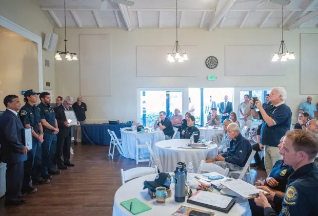 Seal Beach Lifeguards Brett Peoples, center left, and Chris Dominguez...