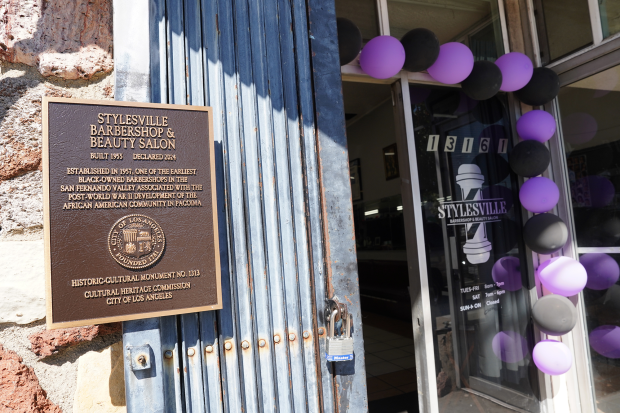 A commemorative plaque honoring the oldest Black-owned barbershop in the...