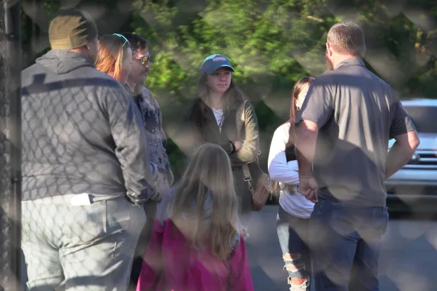 Family members gather at Accurate Energetic Systems, an explosive plant,...