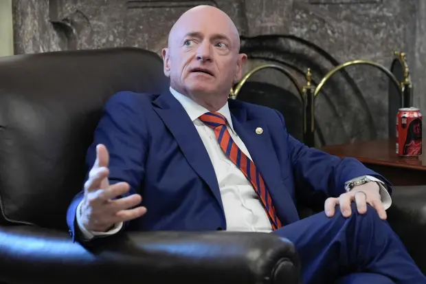 Sen. Mark Kelly, D-Ariz., speaks to reporters on AI during...