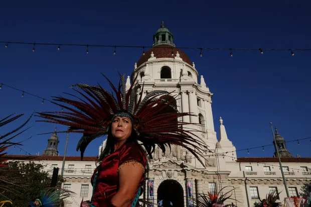 A member of Yankuititl, an Aztec dance group, performs in...