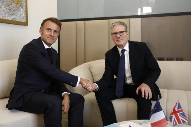 French President Emmanuel Macron, left, attends a bilateral meeting with British Prime Minister Keir Starmer on the sidelines of the Gaza International Peace Summit, in Sharm el-Sheikh, Egypt