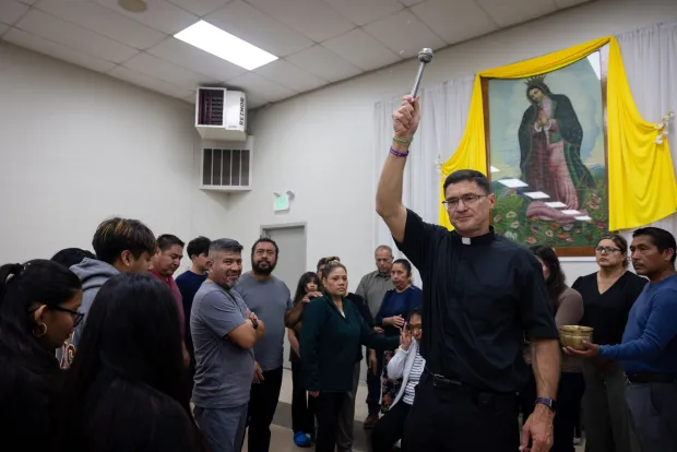Father Scott Santarosa of Our Lady of Guadalupe parish blesses a group on Oct. 1. (Ana Ramirez / The San Diego Union-Tribune)