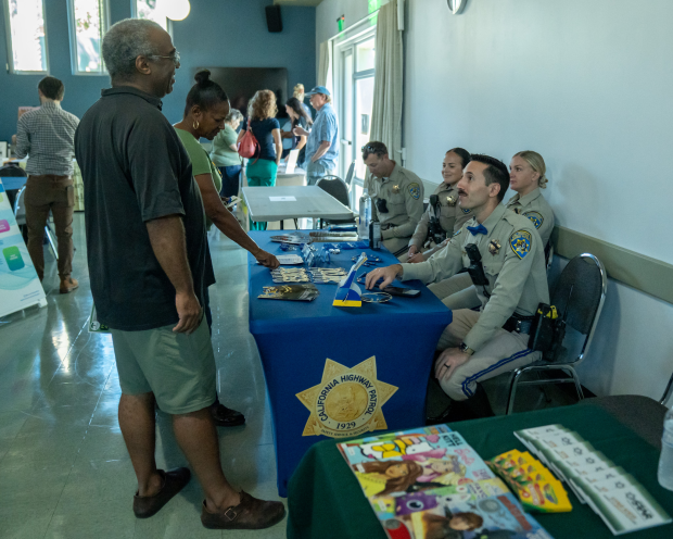 Reggie Wilkins talks to officer Bryan Bay during Altadena Town...