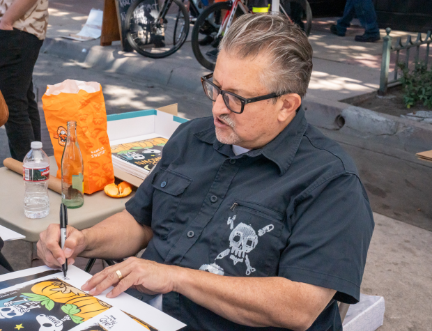 Lalo Alcaraz signing autograph’s for fans during the Casita Del...