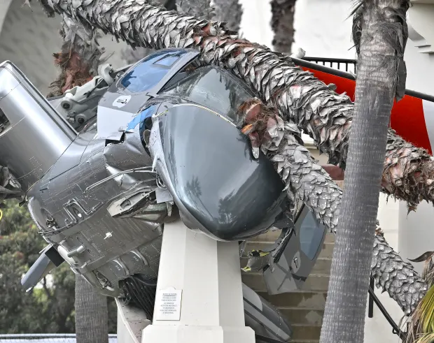 A 1980 Bell 222 helicopter lies where it crashed on...