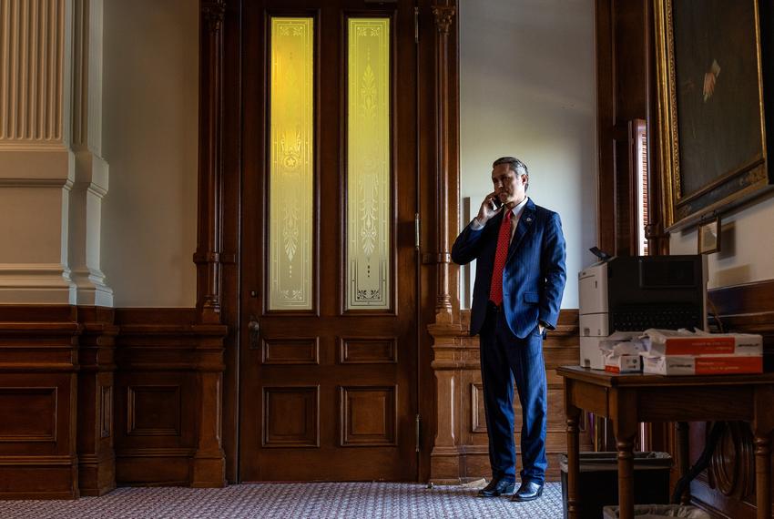 State Rep. Brian Harrison, R- Midlothian, speaks on the phone in the House Chamber in Austin on April 10, 2025.