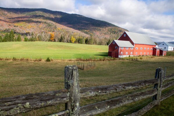 Clouds cast shadows on the mountains behind the Pioneer Farm, also known as the Wallace Farm, in Columbia, N.H., on Thursday, Oct. 9, 2025. (AP Photo/Holly Ramer)