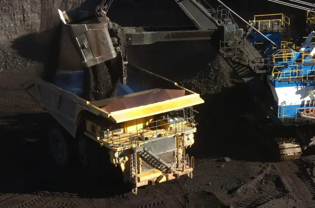 A mechanized shovel loads coal into a haul truck at...