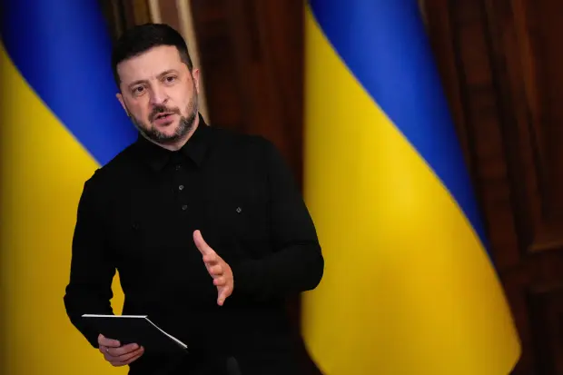 Ukraine’s President Volodymyr Zelenskyy speaks during a news conference with...
