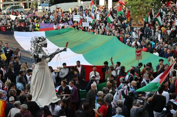 People take part in a pro-Palestinians protest ahead of the...