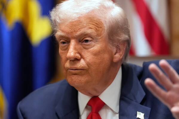 President Donald Trump speaks during a meeting with Argentina's President Javier Milei in the Cabinet Room of the White House, Tuesday, Oct. 14, 2025, in Washington. (AP Photo/Alex Brandon)