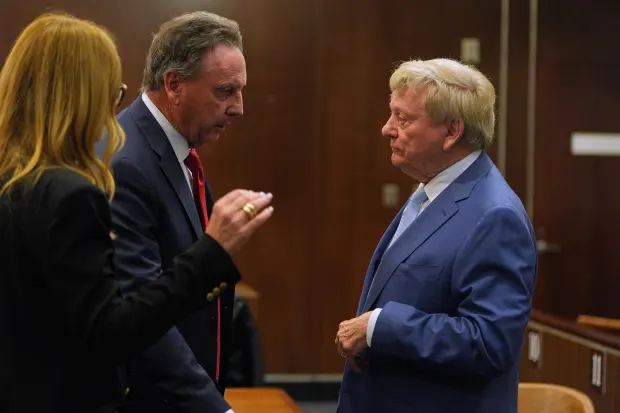 Attorney Rusty Hardin, right, speaks with attorney William Haggerty before...