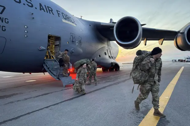 In this photo provided by Alaska National Guard, members of the Alaska National Guard arrive in Kotzebue, Alaska