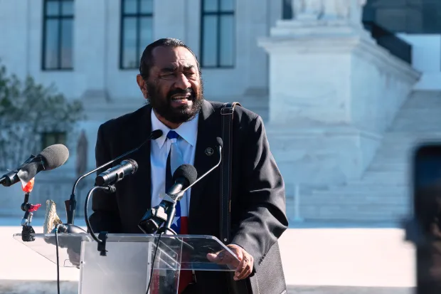 Rep. Al Green, D-Texas, speaks to voting rights activists outside...