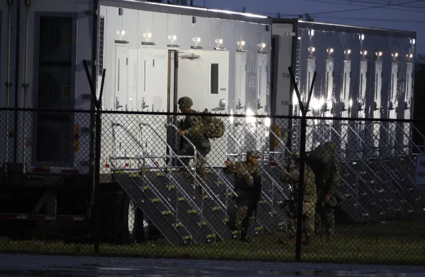 Members of the Texas National Guard assemble at the Army...