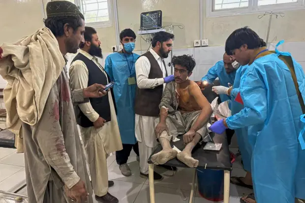 A man, who was injured in the clashes between Pakistan...