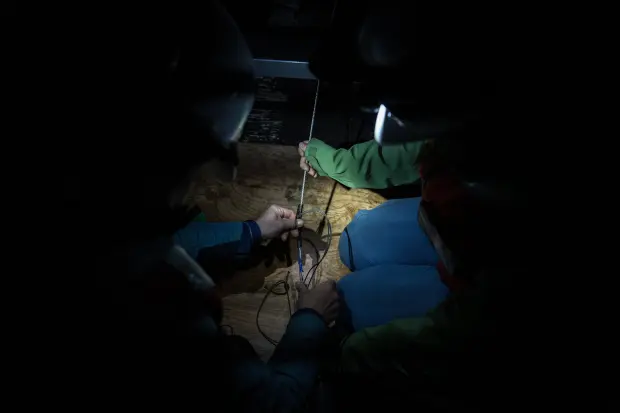 Researchers from the University of Washington prepare to deploy a...