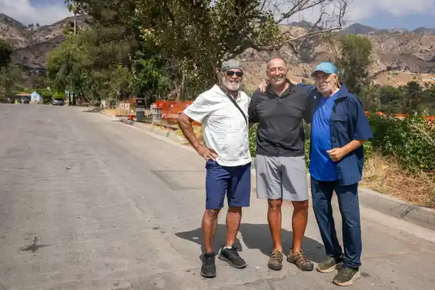 Neighbors Greg Middleton, Marc Archuleta and Martin Gordon gather on McNally Avenue in Altadena on Thursday, Sept. 11, 2025 where they all lost their homes in the Eaton fire. The three all hope to rebuild. (Photo by Sarah Reingewirtz, Los Angeles Daily News/SCNG)
