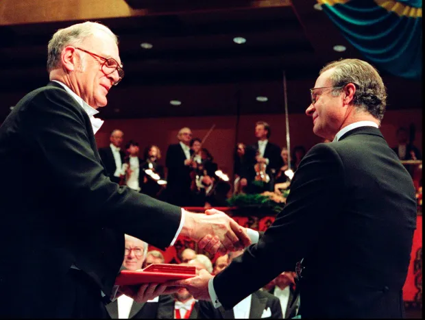 UC Irvine professor F. Sherwood Rowland, left, receives the Nobel prize for chemistry from Swedish King Carl XVI Gustaf, right, at the Concert Hall in Stockholm, Sweden Sunday Dec. 10 1995. Professor Rowland, of the University of California at Irvine, in Irvine, Calif., shares the chemistry prize with Mario Molina, also of the United States, and Paul J. Crutzen of the Netherlands. (AP Photo/Eric Roxfelt)